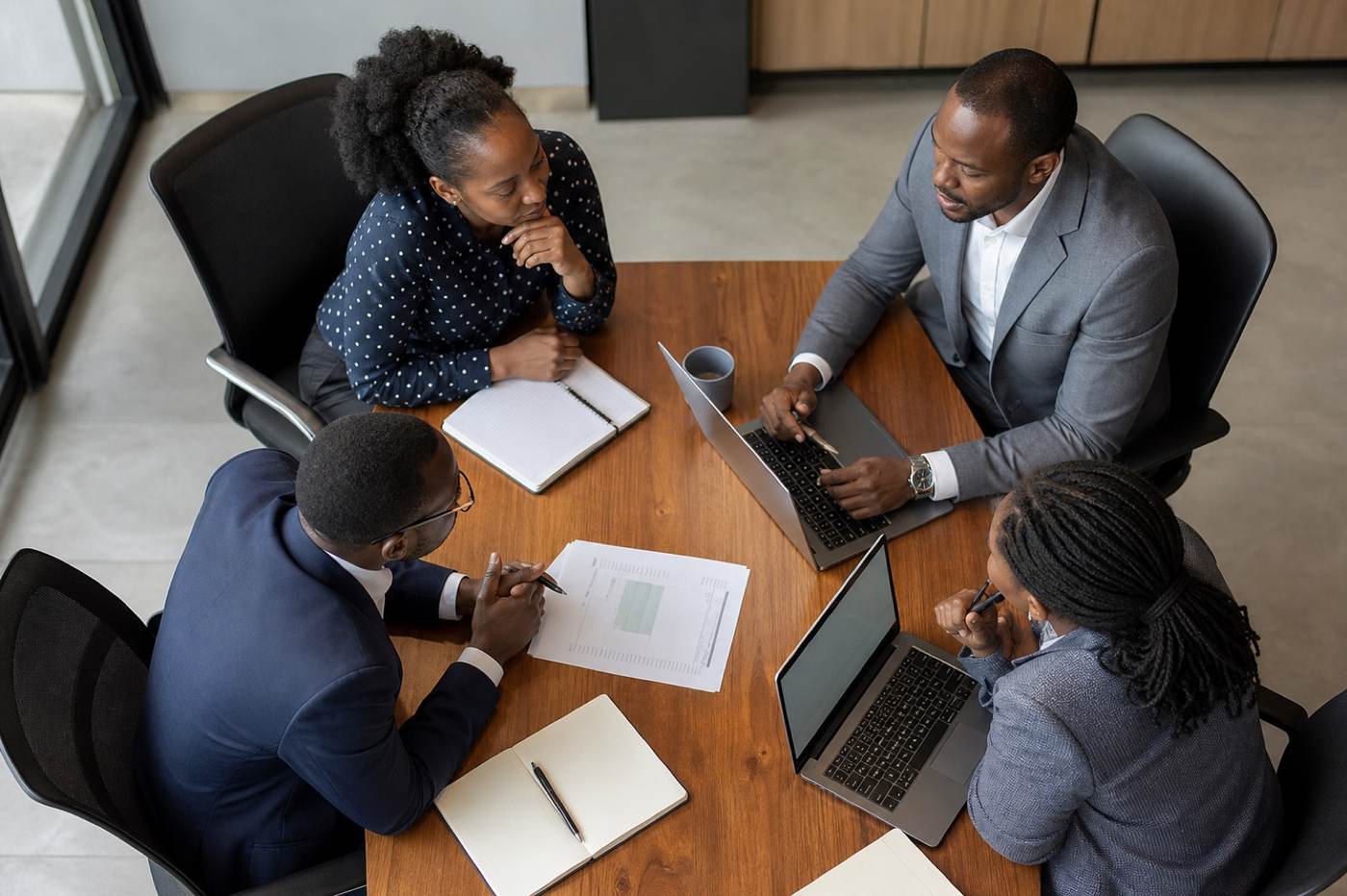 East African professionals working around a meeting table